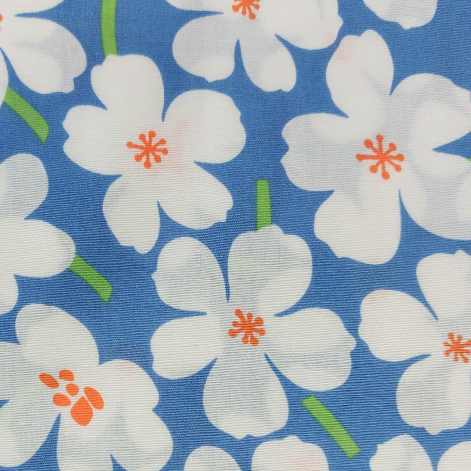 Whtie florwer on blue cotton fabric at More Sewing