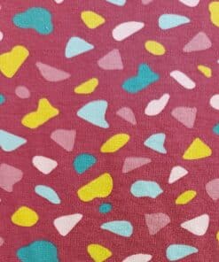 Shapes on dark pink cotton jersey dressmaking fabric at More Sewing