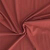 Terracotta plain cotton jersey fabric | More Sewing