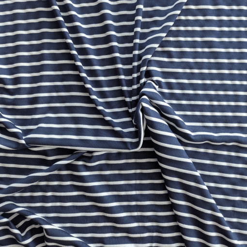 Viscose Blend Fabric Woven Stripe Jersey Fabric In Navy And White. 4 Way Stretch Woven Stripe Fabric.  Navy stripe approx 8mm wide. White stripe approx 4mm wide. Very soft, lightweight drapey jersey.