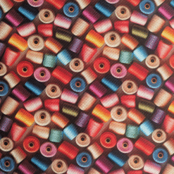 Digital Print 3D Reels Cotton Fabric. Soft cotton fabric with a colourful 3D thread spool/reel pattern. Perfect for dressmaking and craft projects.