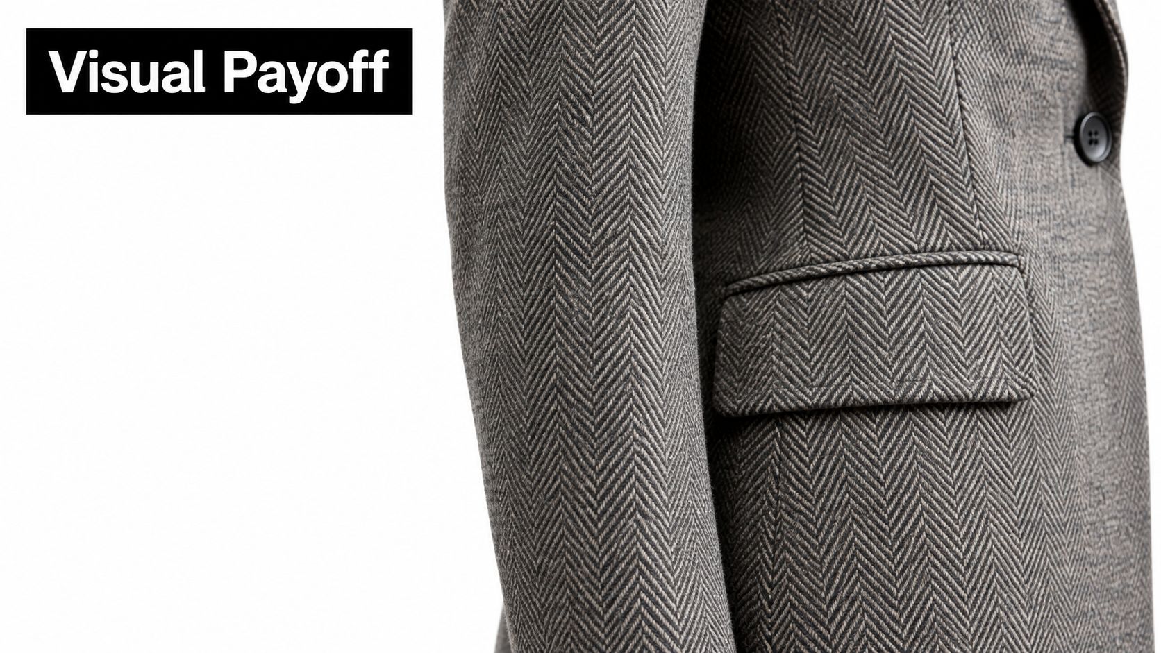 A close-up view of a brown herringbone tweed jacket showing precise fabric pattern matching at the seam.